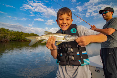 Kids enjoying an inshore fishing charter