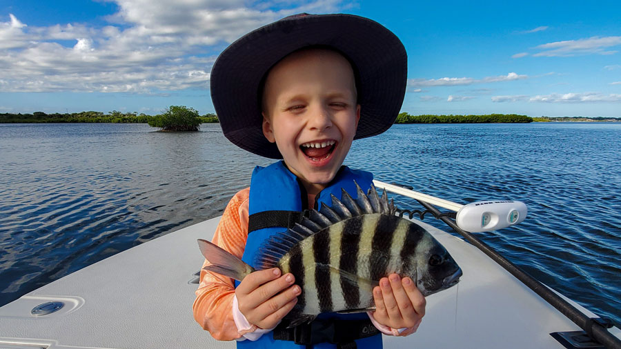 Kids enjoying an easy catching fishing trip near Orlando