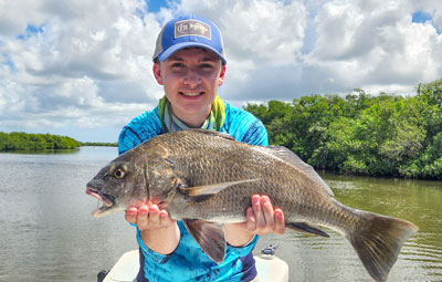 Kids catching fish on a charter trip